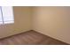 Comfortable bedroom featuring plush carpeting, a large window for natural light, and ample space for furnishings at 7053 Magic Moment Ln, Las Vegas, NV 89119