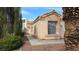 Charming single-story home exterior with a well-maintained landscaped front yard and desert landscaping at 7053 Magic Moment Ln, Las Vegas, NV 89119