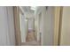 Hallway featuring neutral paint and carpet that connects different areas of the home at 7053 Magic Moment Ln, Las Vegas, NV 89119