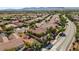 Elevated view of a suburban neighborhood featuring tile-roofed homes and well-maintained landscaping at 7204 Royal Melbourne Dr, Las Vegas, NV 89131