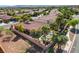 Aerial view of a neighborhood showcasing the backyard with private pool, landscaping and tile-roofed homes at 7204 Royal Melbourne Dr, Las Vegas, NV 89131