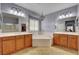 Spacious bathroom with double vanities, a tub, and tiled floors at 7204 Royal Melbourne Dr, Las Vegas, NV 89131