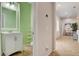 Half bath with a modern vanity and open shelving at 7204 Royal Melbourne Dr, Las Vegas, NV 89131