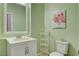 Bright bathroom with a modern vanity, and decorative art at 7204 Royal Melbourne Dr, Las Vegas, NV 89131