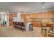 Gourmet kitchen with stainless appliances, a breakfast bar, and granite countertops, ideal for culinary enthusiasts and chefs at 7204 Royal Melbourne Dr, Las Vegas, NV 89131