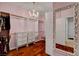 Walk-in closet with custom shelving, drawers, and a full-length mirror at 7204 Royal Melbourne Dr, Las Vegas, NV 89131