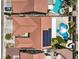 A top-down aerial of a house with solar panels, desert landscaping, and a uniquely shaped pool at 7489 Crystal Clear Ave, Las Vegas, NV 89113