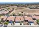 An aerial view of a neighborhood featuring manicured lawns and private pools at 7489 Crystal Clear Ave, Las Vegas, NV 89113