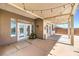 A covered patio with string lights and access to pool and outdoor living spaces at 7489 Crystal Clear Ave, Las Vegas, NV 89113