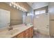 Bathroom featuring double sinks, tub/shower combination and large mirror at 7489 Crystal Clear Ave, Las Vegas, NV 89113