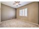 Bedroom featuring neutral paint, carpet, plantation shutters and ceiling fan at 7489 Crystal Clear Ave, Las Vegas, NV 89113