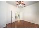 Bedroom with wood floors, ceiling fan showing open doors to hallway at 7489 Crystal Clear Ave, Las Vegas, NV 89113