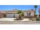 Charming single-story home with desert landscaping, two-car garage, and stone accents at 7489 Crystal Clear Ave, Las Vegas, NV 89113