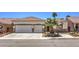 Charming single-story home with desert landscaping, two-car garage, and stone accents at 7489 Crystal Clear Ave, Las Vegas, NV 89113
