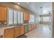 Bright kitchen featuring stainless steel appliances, granite countertops, and light wood cabinetry at 7489 Crystal Clear Ave, Las Vegas, NV 89113