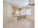 Open-concept living room with tiled floors and neutral paint throughout at 7489 Crystal Clear Ave, Las Vegas, NV 89113