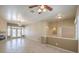 Spacious living room with a fireplace, tiled floors and abundant natural light at 7489 Crystal Clear Ave, Las Vegas, NV 89113