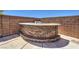 Outdoor kitchen and bar features a brick surround and a built-in barbecue at 7489 Crystal Clear Ave, Las Vegas, NV 89113