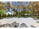 Outdoor basketball court surrounded by mature trees, offering a recreational space within the community at 7589 Grassy Bank St, Las Vegas, NV 89139