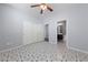 Bedroom with neutral walls, closet, ceiling fan and ensuite bathroom at 7589 Grassy Bank St, Las Vegas, NV 89139