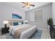 Stylishly decorated bedroom with ceiling fan and coordinated decor at 7589 Grassy Bank St, Las Vegas, NV 89139