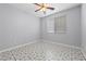 Bedroom with neutral walls and eye catching decorative tile flooring at 7589 Grassy Bank St, Las Vegas, NV 89139