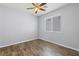 Bright bedroom featuring modern ceiling fan, window with blinds, and neutral wall color at 7589 Grassy Bank St, Las Vegas, NV 89139