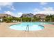 Community pool featuring sun loungers and well-maintained landscaping providing a relaxing environment at 7589 Grassy Bank St, Las Vegas, NV 89139