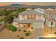 Stunning aerial view of the brick-accented two-story home in a peaceful neighborhood at 7931 Campers Village Ave, Las Vegas, NV 89178