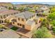 Bird's-eye view of home, highlighting backyard, brick patio, artificial turf and desert landscaping at 7931 Campers Village Ave, Las Vegas, NV 89178