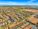 Wide aerial view of Primary-planned community with mountain views, with the yellow icon marking the approximate location at 7931 Campers Village Ave, Las Vegas, NV 89178