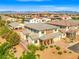 Elevated view of a beautiful home nestled in a residential area with mountain views in the background at 7931 Campers Village Ave, Las Vegas, NV 89178