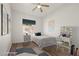 Cozy bedroom with natural light, neutral decor, hardwood floors, and a relaxing vibe at 7931 Campers Village Ave, Las Vegas, NV 89178