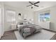 Serene bedroom with a neutral color palette, bright windows, and modern furnishings at 7931 Campers Village Ave, Las Vegas, NV 89178