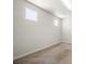 Bedroom with neutral walls, carpet, and two windows at 7931 Campers Village Ave, Las Vegas, NV 89178