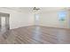 Bright bonus room featuring wood floors, recessed lights and two windows at 7931 Campers Village Ave, Las Vegas, NV 89178