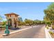 View of the gated community entrance, providing security, controlled access, and a welcoming first impression at 7931 Campers Village Ave, Las Vegas, NV 89178