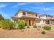 Charming two-story home with desert landscaping, brick details, and a spacious two-car garage at 7931 Campers Village Ave, Las Vegas, NV 89178