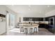 Modern kitchen with a large island, stainless steel appliances, and dark cabinetry at 7931 Campers Village Ave, Las Vegas, NV 89178