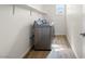 Clean laundry room with machines and shelving at 7931 Campers Village Ave, Las Vegas, NV 89178