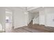 The living room showcases modern lighting, a staircase, and two doors at 7931 Campers Village Ave, Las Vegas, NV 89178