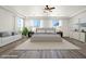 Large main bedroom featuring hardwood floors, plenty of natural light and neutral decor at 7931 Campers Village Ave, Las Vegas, NV 89178