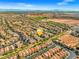 Scenic aerial view of the neighborhood highlighting the home's location, community layout and city skyline at 7931 Campers Village Ave, Las Vegas, NV 89178