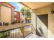 Cozy balcony overlooking the complex's landscaped grounds and parking area at 8000 Badura Ave # 1058, Las Vegas, NV 89113