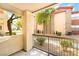 View from a private balcony showcasing the surrounding greenery and building facade at 8000 Badura Ave # 1058, Las Vegas, NV 89113