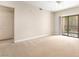 Bedroom with neutral carpet, sliding glass door and natural light at 8000 Badura Ave # 1058, Las Vegas, NV 89113