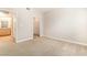 Bedroom featuring an ensuite bathroom and closet with neutral carpet at 8000 Badura Ave # 1058, Las Vegas, NV 89113