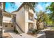 Apartment building with multiple units, stair access, and well-kept grounds at 8000 Badura Ave # 1058, Las Vegas, NV 89113