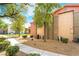 Exterior building showcasing the well-maintained grounds and walking paths at 8000 Badura Ave # 1058, Las Vegas, NV 89113