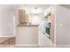 Kitchen featuring light wood cabinets and white appliances at 8000 Badura Ave # 1058, Las Vegas, NV 89113